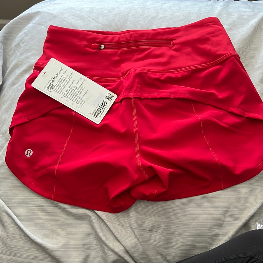 Selling red lululemon shorts for $65 brand new size 2